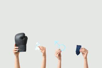 Female hands with boxing glove, light blue ribbon, male sign and tie on white background. Prostate...