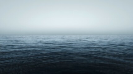 Fototapeta premium Ocean water with fog or mist obscuring the horizon creating a minimalist scene.