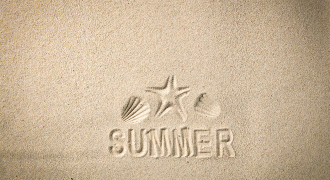 Starfish and summer writing on the sand with copy space for a product. Sandy background and beach in summer.