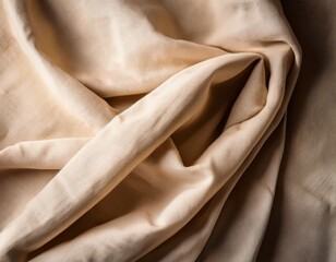 Beige fabric texture with elegant soft folds in close-up view