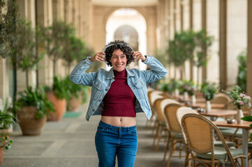 Tourist wearing headphones and enjoying music