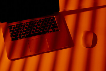 Stylish Office Desk with Laptop and Wireless Mouse.