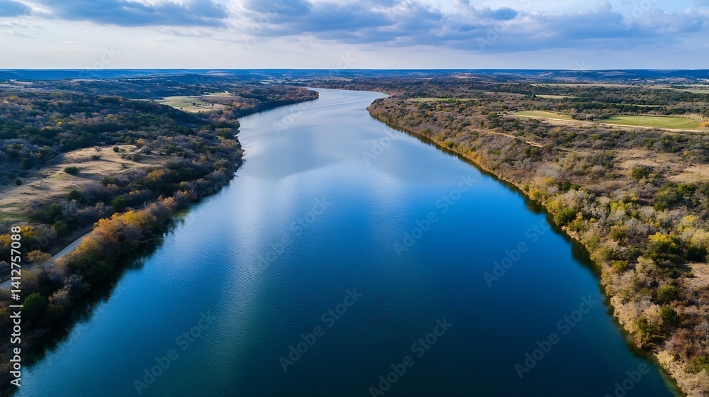 Poster aerial view of breathtaking river surrounded by lush green landscape and colorful trees : generative