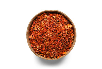 Wooden bowl with chili flakes isolated on white background