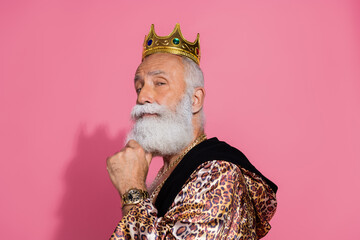 Photo of successful king hand touch beard wear leopard robe gold tiara isolated on pink color...