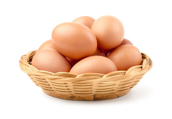 Fresh chicken eggs in wicker basket isolated onwhite background.