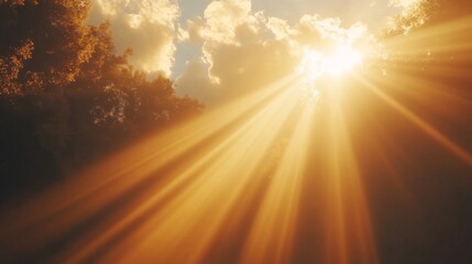 Fototapeta premium Golden Sunbeams Through Clouds at Sunset