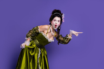 Elegant woman in a green historic dress posing against a purple background, embodying a regal and aristocratic character