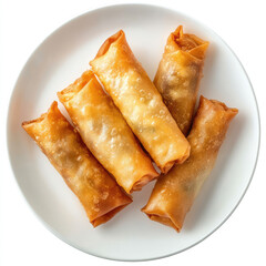 A top down view of six golden brown spring rolls on a white circular plate isolated