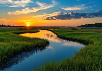 Serene Sunset Over Marshland With Reflective Waterway Surrounded By Lush Green Grass Under Stunning Sky Colors