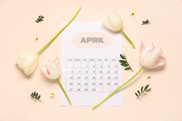 Composition with paper calendar of April and beautiful spring flowers on color background