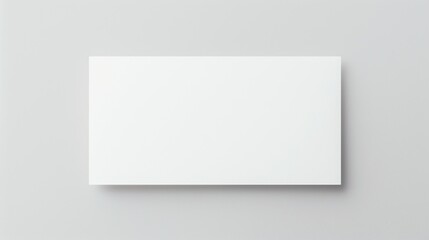 Blank white card on a flat surface, symbolizing simplicity and clarity in design.