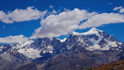 Fototapeta premium Snowy Peaks Under Blue Skies