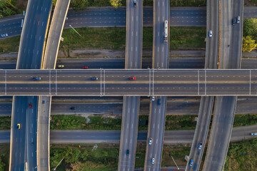 Aerial view of Expressway transport traffic road with vehicle movement in morning, Logistic concept.