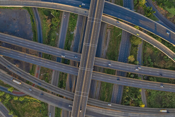 Fototapeta premium Aerial view of Expressway transport traffic road with vehicle movement in morning, Logistic concept.