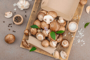 Fresh raw cremini mushrooms with spices and herbs. Healthy ingredient for cooking vegan food