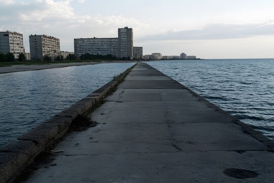 Fototapeta Coastal Cityscape Concrete Pier Ocean View Buildings