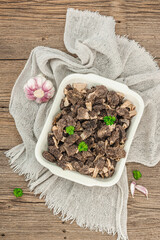 Raw black morel mushrooms with fresh parsley. Vegan ingredient for cooking healthy food