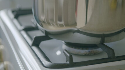 A modern kitchen with a pot on a gas stove, highlighting innovative design and functionality