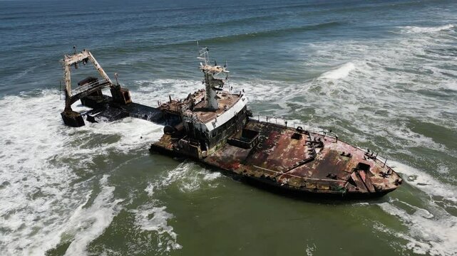 Zeila Shipwreck Namibia washed by waves on South Atlantic Ocean in sunny weather in Skeleton Coast