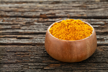 Organic turmeric powder in a bowl - Curcuma longa