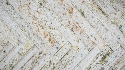 Obraz premium Rustic cedar herringbone paneling with faded hues and moss stains perfect for adding natural warmth to your design projects