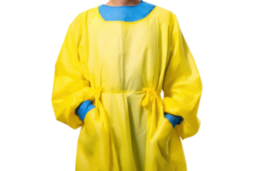 A Frontline Hero's Protective Gear: Yellow Isolation Gown with Blue Gloves, Ready to Fight the Pandemic and Keep Us Safe During Medical Procedures.