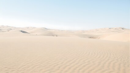 Explore the intricate beauty of wind shaped desert dunes under a vast clear sky in this mesmerizing photograph