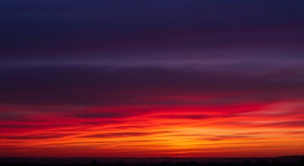 Fototapeta premium Vibrant Sunset with Layers of Colorful Clouds