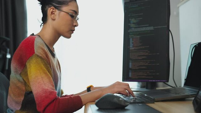 Hands Coding on Laptop CLOSE UP. Woman using portable computers. Woman programmer writes code