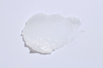 Moisturizing lip balm on white background, top view