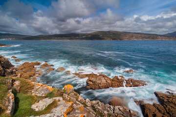 Ocean waves crashing on rocks in galicia, spain