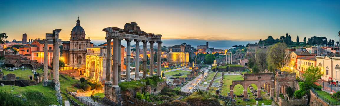 Ruins of Roman forum at dawn in Rome. Italy with Inscription "Senatus Populusque Romanus incendio consumptum restituit" - The Senate and People of Rome restored what had been consumed by fire