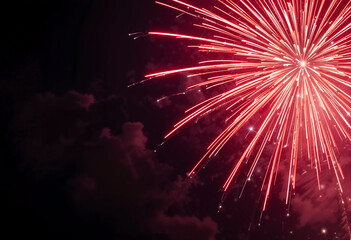 Stunning red fireworks display lighting up the night sky