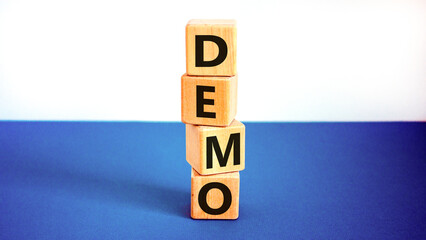 Demo symbol. Concept word Demo on beautiful wooden blocks. Beautiful white and blue background....