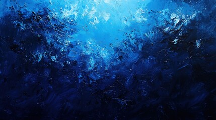 Obraz premium Swirling shades of deep blue create a mesmerizing visual experience, depicting the vastness of an underwater world filled with motion and life. The blend of colors evokes tranquility and depth