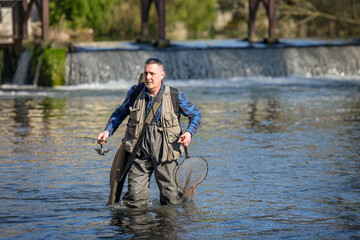 view of a man fishing in a river in Seine et Marne