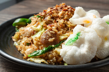 A closeup view of a plate of Indonesian style fried rice.