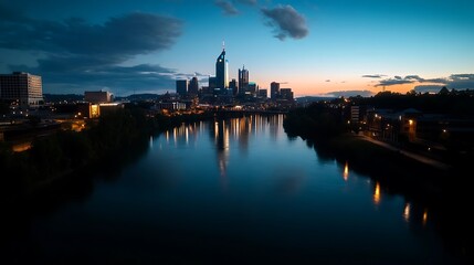 Fototapeta premium Nashville skyline reflected in a tranquil river at dawn.