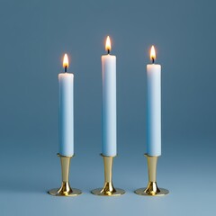 Three tall light blue candles with steady flames, arranged in elegant gold holders against a monochromatic blue background, creating a serene and cohesive composition.