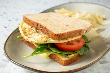 A view of an egg sandwich entree.
