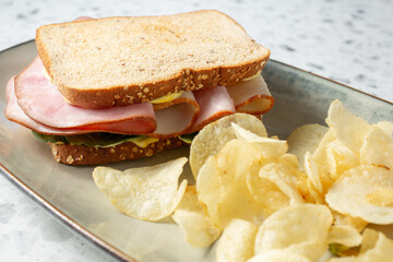 A view of a turkey and ham sandwich.