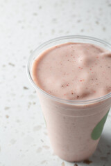 A view of a strawberry smoothie.