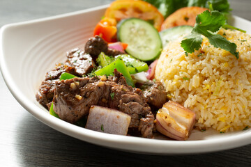 A closeup view of a plate of shaking beef.