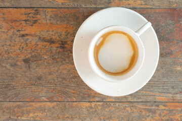 A top down view of a cup of macchiato.