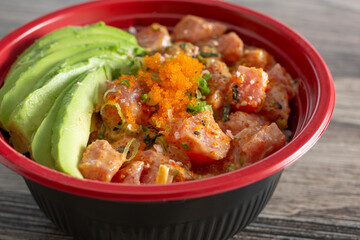 A closeup view of a spicy poke bowl.
