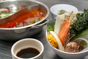 A view of elements for a hot pot entree.