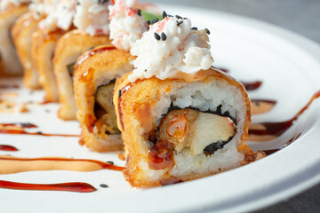 A closeup view of a deep fried sushi roll. © DAVID