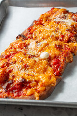 A closeup view of cheese flatbread.