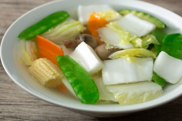 A closeup view of a bowl of vegetable soup.